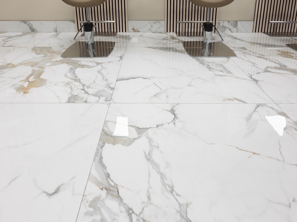 Large-format polished tile flooring in a modern interior